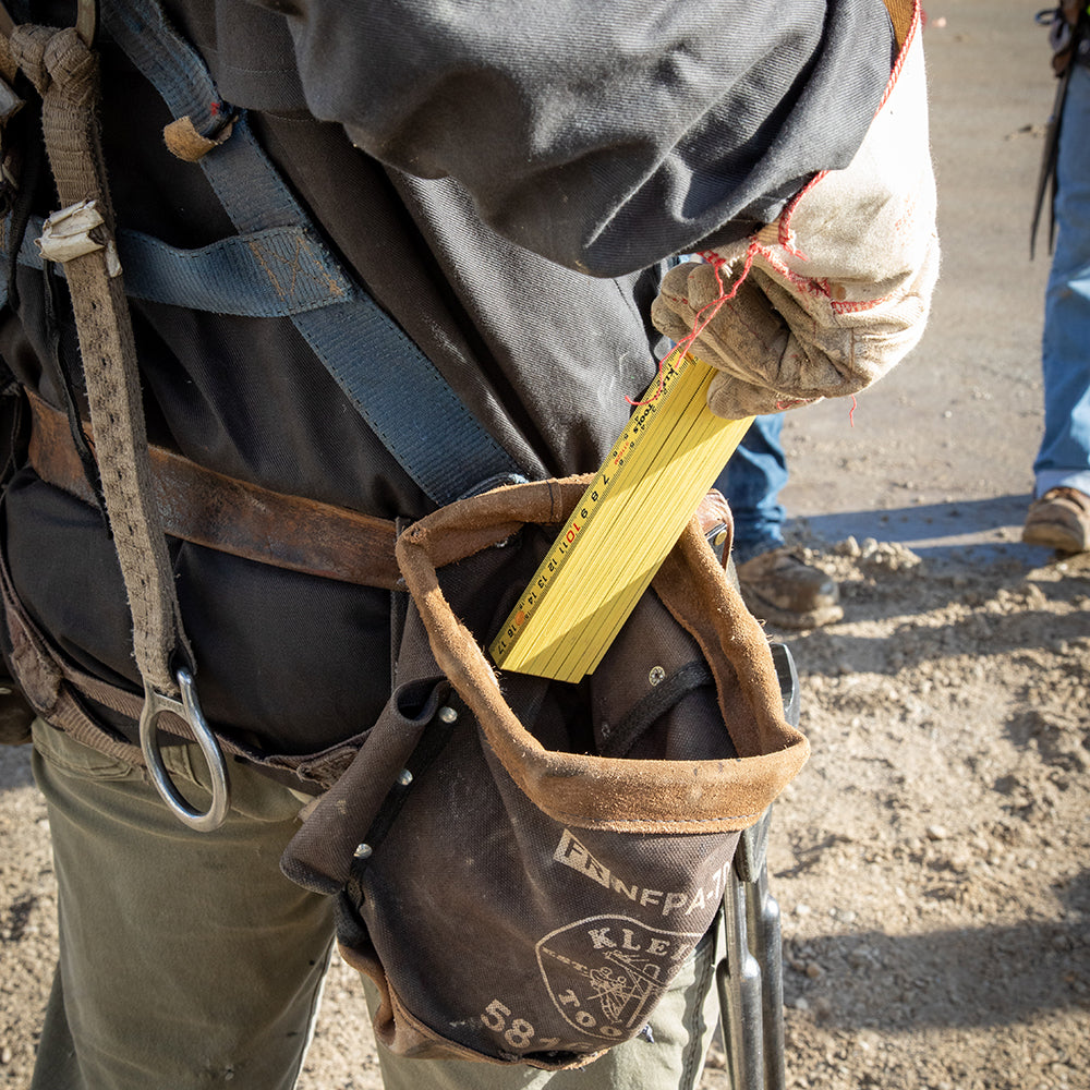 Klein brick scale folding ruler measuring on a jobsite