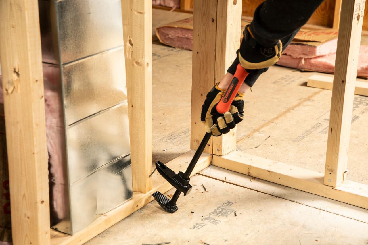 Crescent 24-in. Adjustable Pry Bar in use on a construction site