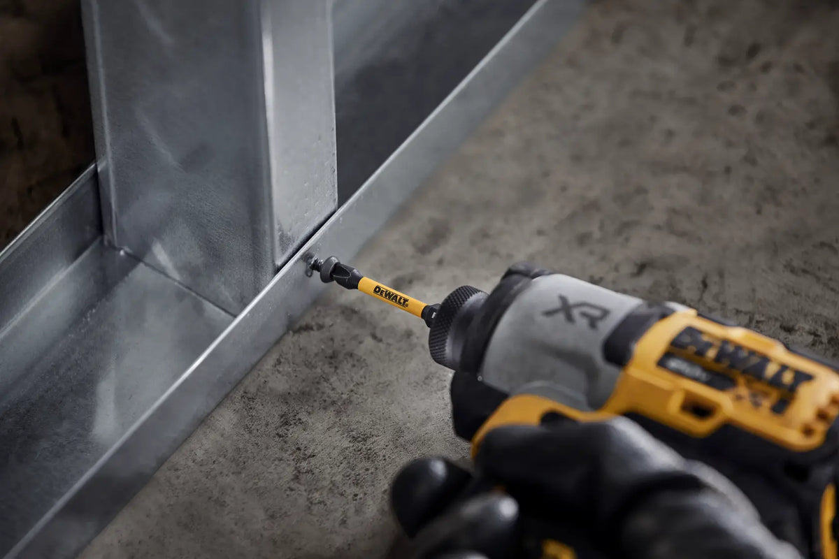 DeWALT ELITE SERIES Phillips #2 impact bit with magnetic sleeve in an impact driver fastening into a metal stud