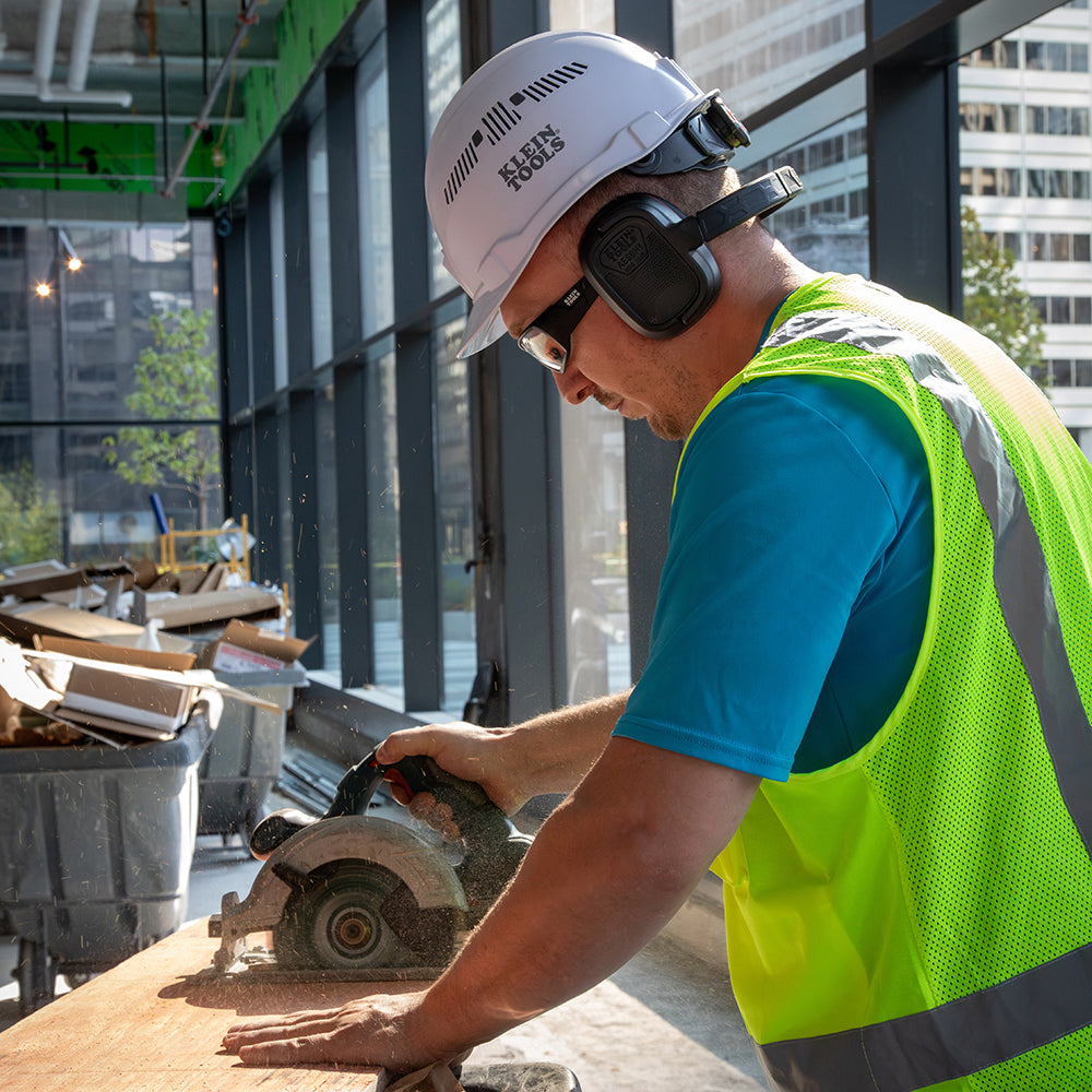 Klein Bluetooth earmuffs in use on a jobsite