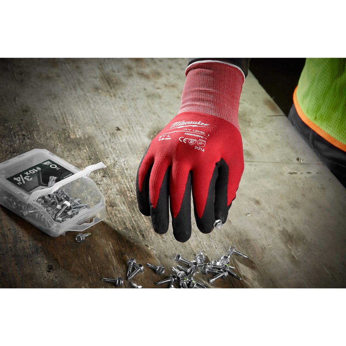 Milwaukee Cut Level 1 Nitrile Dipped Gloves picking up screws