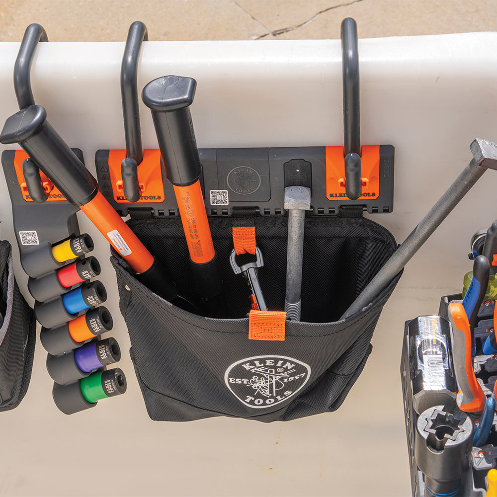Klein Hardware Pouch Module BC510S hanging on a lineman utility bucket rim holding hardware