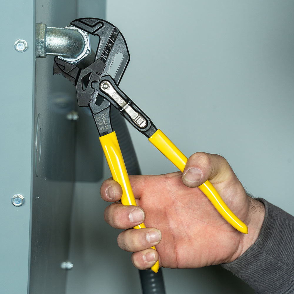 Klein plier wrench in use on conduit