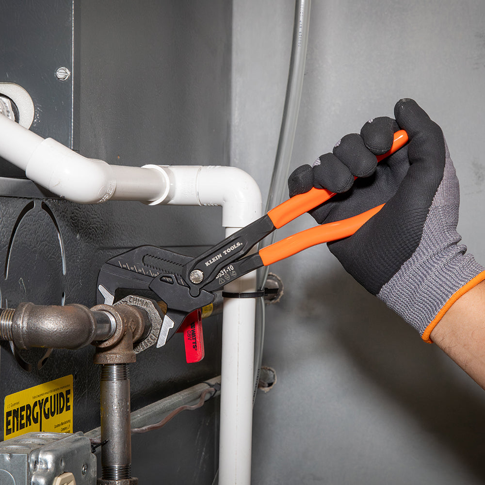 Klein compact plier wrench holding a pipe