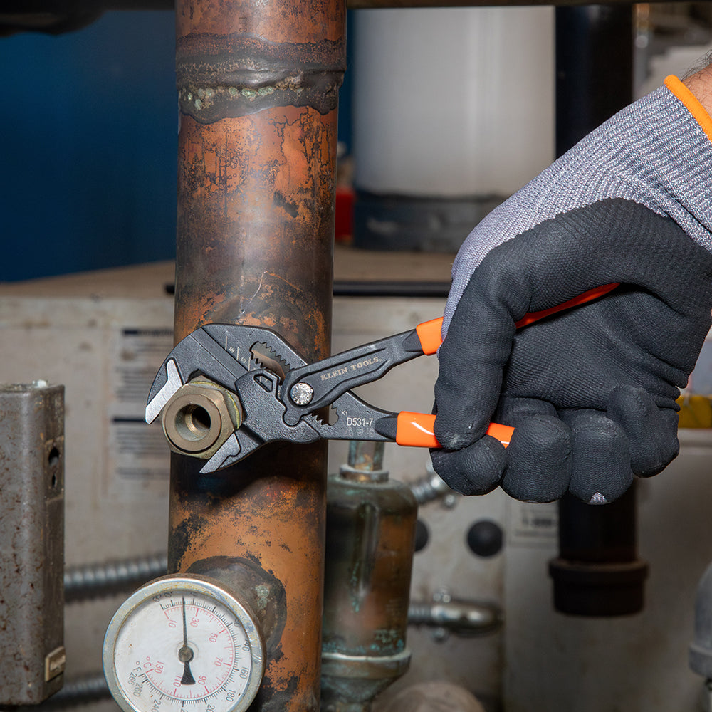 Klein compact plier wrench tightening a nut