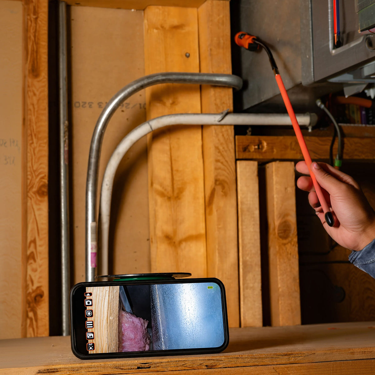 Klein Tools Compact Wireless Inspection Camera (ET30) viewing a live feed on a phone during an inspection