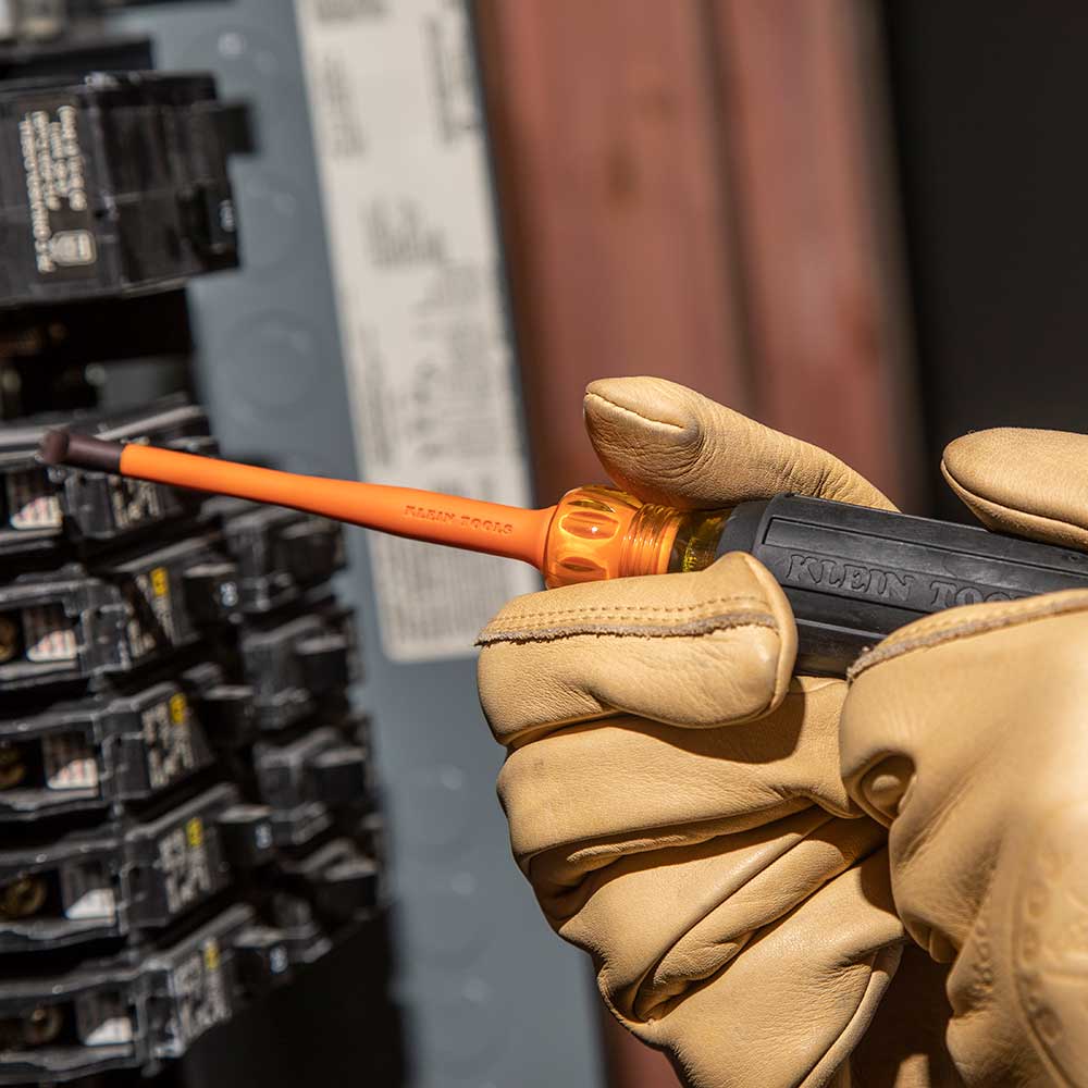 Klein slim-tip insulated screwdriver working in a panel