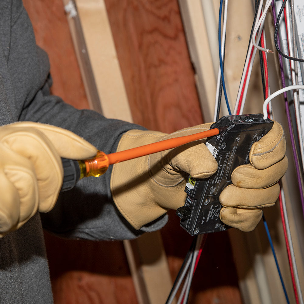 Klein slim-tip insulated screwdriver reaching a recessed terminal