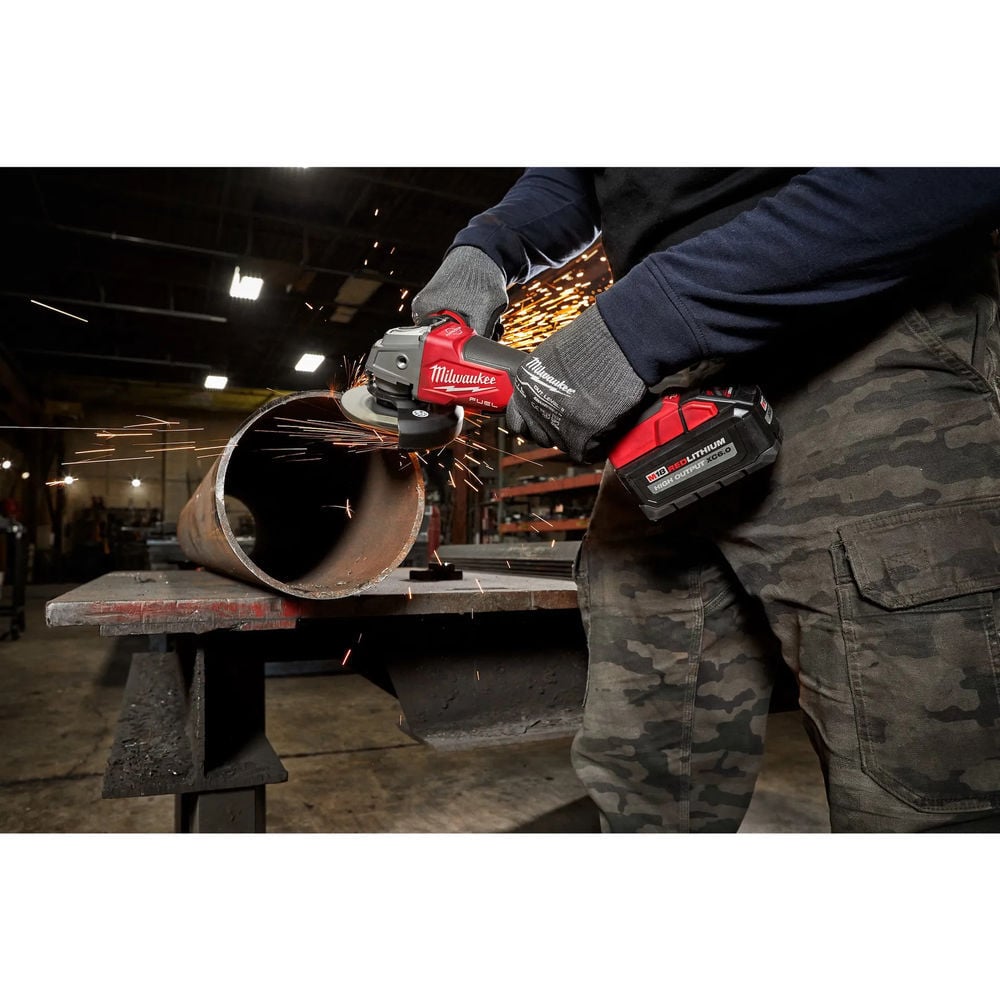 Milwaukee M18 FUEL grinder cutting metal