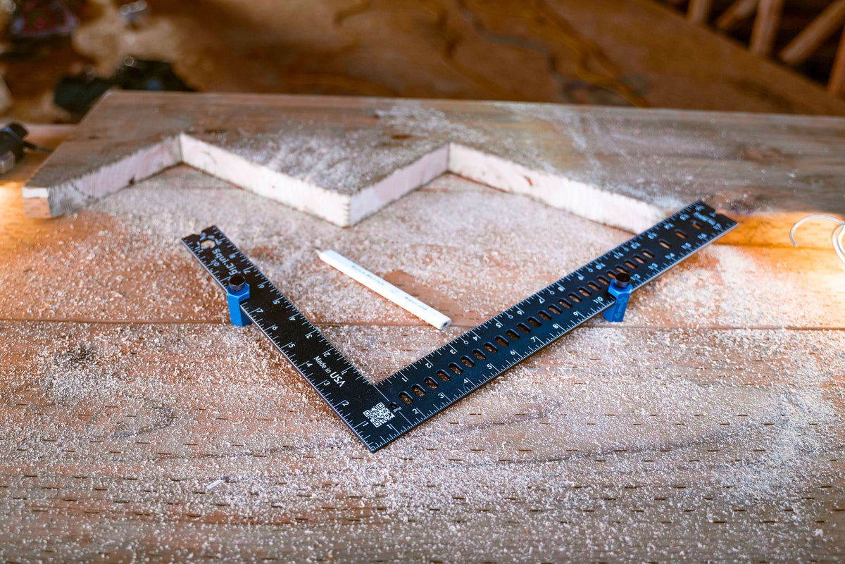 SquiJig framing jigs clamped on a framing square for stair stringer layout